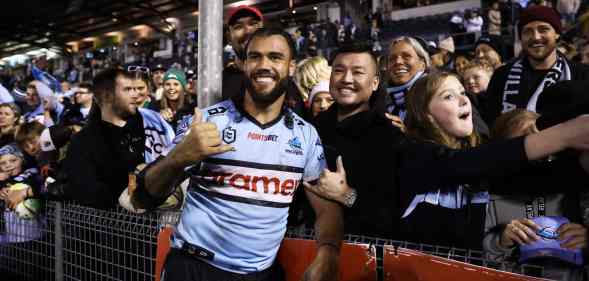 Toby Rudolf of the Sharks celebrates with fans after the round 20 NRL match between the Cronulla Sharks and the South Sydney Rabbitohs