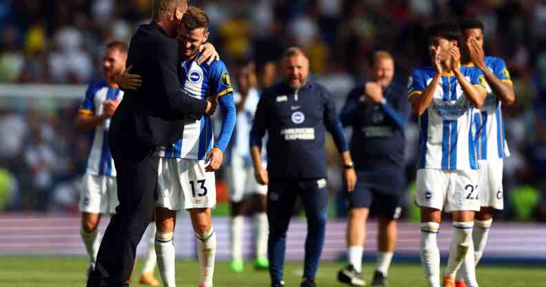Graham Potter, manager of Brighton and Hove Albion celebrates with Pascal Gross
