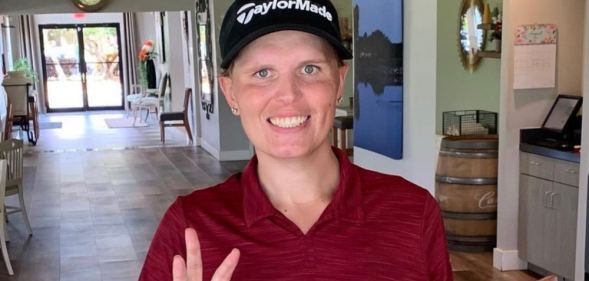 In this photograph, Hailey Davidson poses while wearing a hat