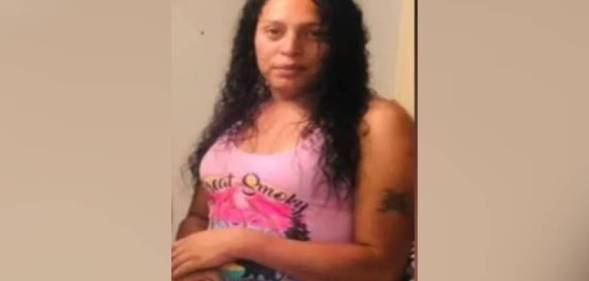 Marisela Castro, a trans woman who was killed in Houston, Texas, wears a pink tank top as she poses for a photo