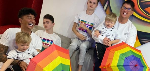 Paul (L) and Michael (R) with their four sons.