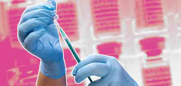 Gloved hands preparing a vaccine on a pink background