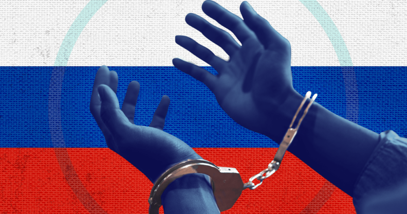A colourised photo of blue hands in handcuffs in front of the Russian flag