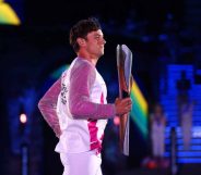 Tom Daley carries the Queen’s Baton during the Opening Ceremony of Commonwealth Games.