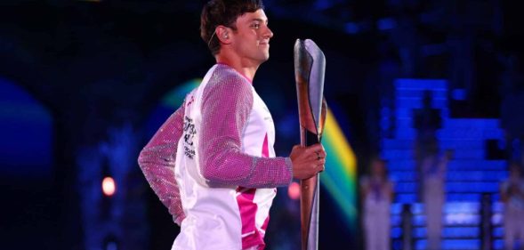 Tom Daley carries the Queen’s Baton during the Opening Ceremony of Commonwealth Games.