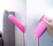 In these side-by-side photographs, a penis-shaped lamp hangs on a wall