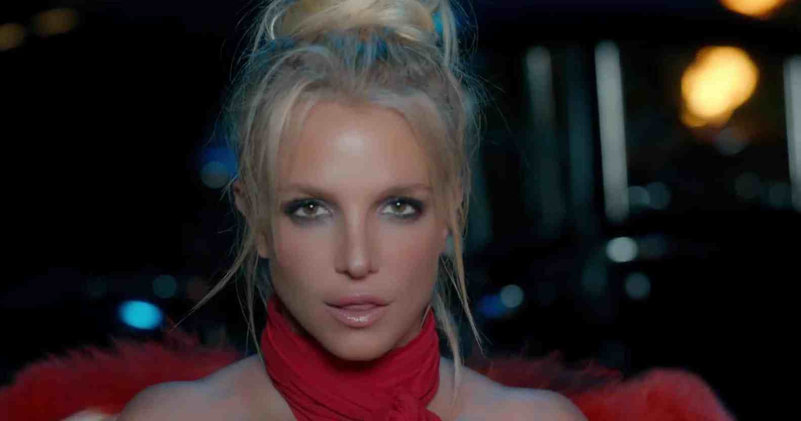 Britney Spears in a red halterneck top
