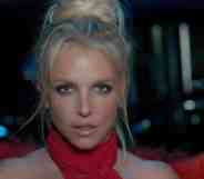 Britney Spears in a red halterneck top