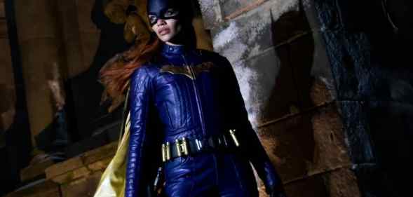Leslie Grace poses in the purple Batgirl costume