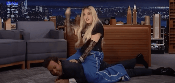 Madonna riding Jimmy Fallon.