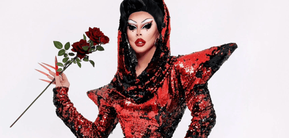 Cherry Valentine posing in an iconic drag look.