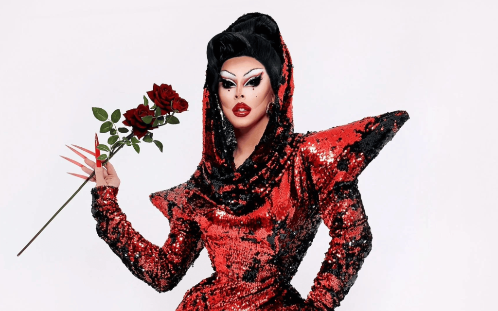 Cherry Valentine posing in an iconic drag look.