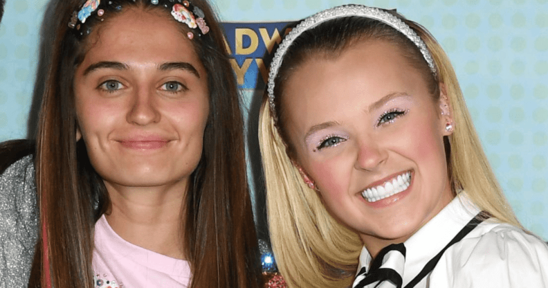 JoJo Siwa smiles for the camera as she stands alongside girlfriend Avery Cyrus
