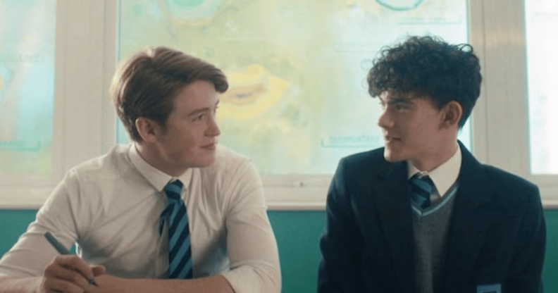 Heartstopper characters Charlie and Nick stare at each other