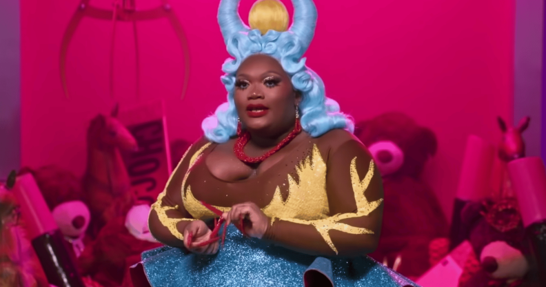 Drag Race star Kornbread Jeté sits during an interview