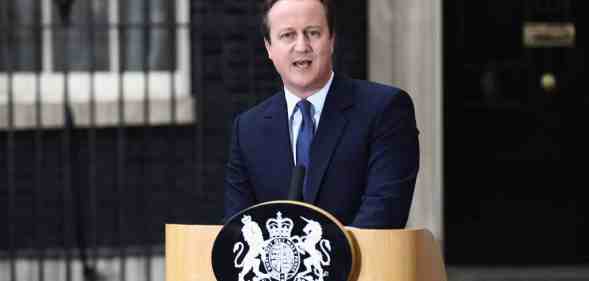 Prime minister David Cameron stands at a podium