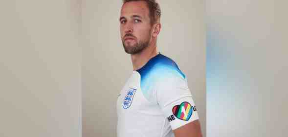 Harry Kane wears a rainbow heart armband in a professional photo