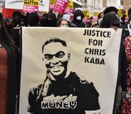 Protesters hold a banner that reads "justice for Chris Kaba" during a march in London