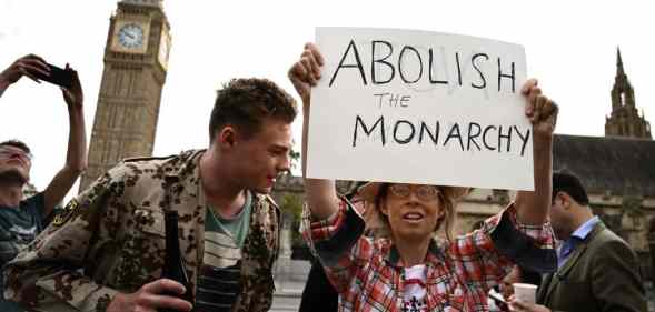 An anti-Royal demonstrator protests outside Palace of Westminster, central London on September 12, 2022.