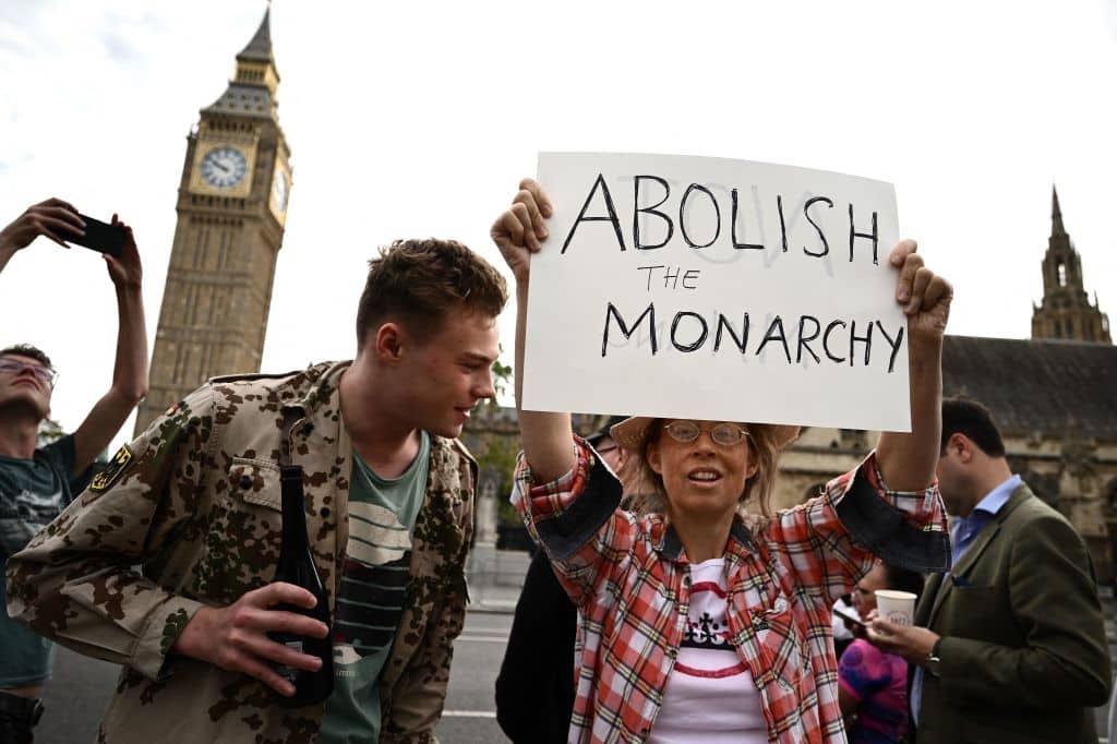 An anti-Royal demonstrator protests outside Palace of Westminster, central London on September 12, 2022.