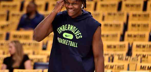 Anthony Edwards warms up in a sleeveless hoodie.