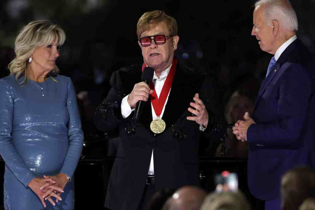 Elton John in tears as President Biden surprises him with medal at White House