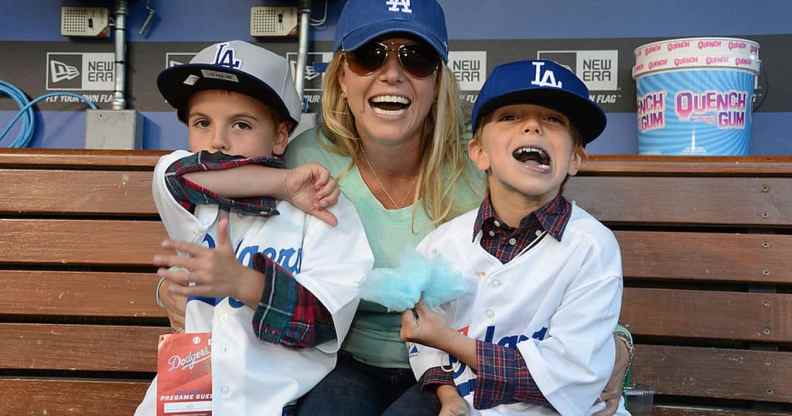 Britney Spears poses with sons Sean Preston Federline (L) and Jayden James Federline (R) during agame against the San Diego Padres at Dodger Stadium on April 17, 2013.