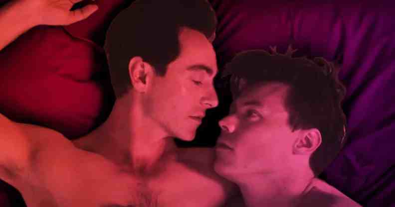 Harry Styles and David Dawson lying naked in bed (seen from the shoulders up)