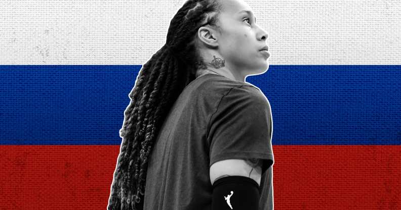 Brittney Griner infront of the Russian flag.