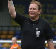 Trans football referee Lucy Clark smiles as she officiates a match