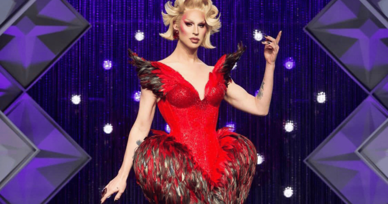 Brooke Lynn Hytes in a read dress on the Drag Race main stage