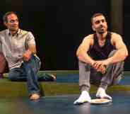 Zafar and Bilal sitting on a sparse stage