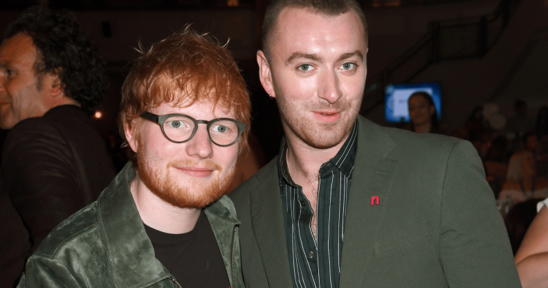 Ed Sheeran and Sam Smith smile and stand next to each other