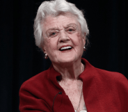 Angela Lansbury wears red as she smiles for the camera