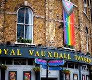 The exterior of Royal Vauxhall Tavern with an LGBTQ+ Progressive Pride flag hanging down one side of the venue