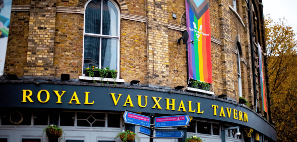 The exterior of Royal Vauxhall Tavern with an LGBTQ+ Progressive Pride flag hanging down one side of the venue
