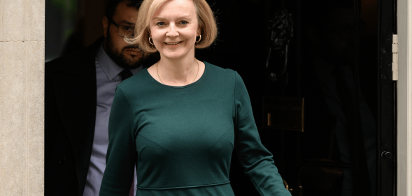 Liz Truss wears a dark green outfit as she exits 10 Downing Street