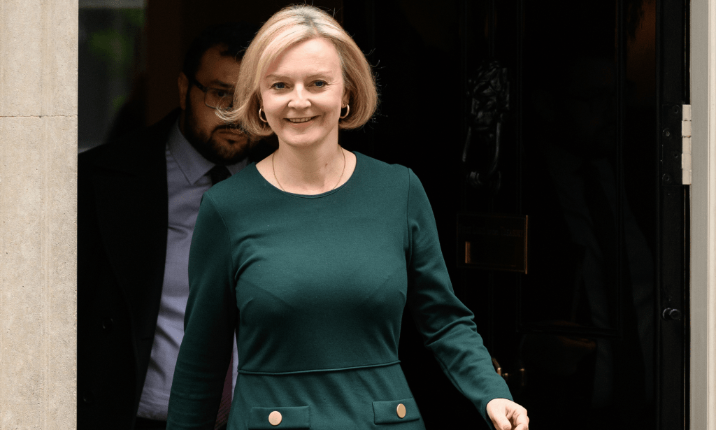 Liz Truss wears a dark green outfit as she exits 10 Downing Street