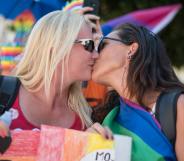 An image of two women kissing at a Pride parade in Maribor, Slovenia