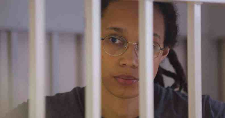 Brittney Griner waits for the verdict inside a defendants' cage during a hearing in Khimki outside Moscow.