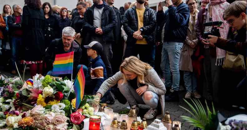 Mourners place candles and flowers at a makeshift memorial in downtown Bratislava.