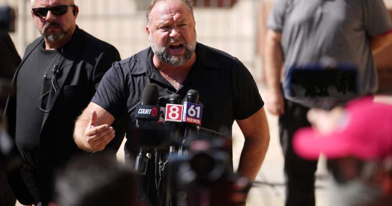 Alex Jones speaks to the media outside Waterbury Superior Court during the defamation trial in Connecticut