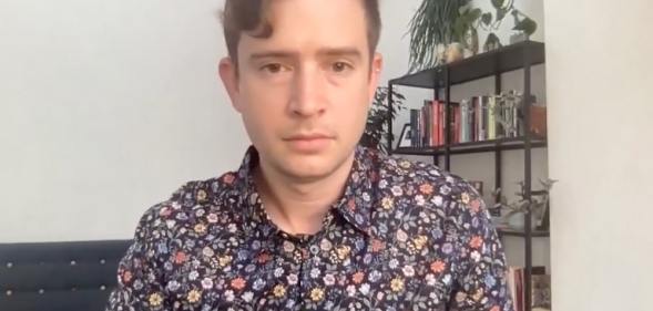 A screenshot of Dr Jacob Breslow speaking on a Zoom book launch.