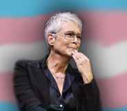 Jamie Lee Curtis in front of the trans flag
