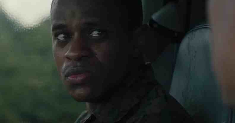 A still from the movie The Inspection shows actor Jeremy Pope sitting in front of a window and looking worried