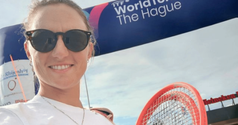 Nadia Podoroska smiling, holding a tennis racket