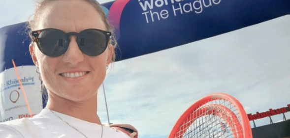Nadia Podoroska smiling, holding a tennis racket