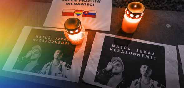 Photos are placed next to candles to honour the gay men killed by a terrorist in Slovakia