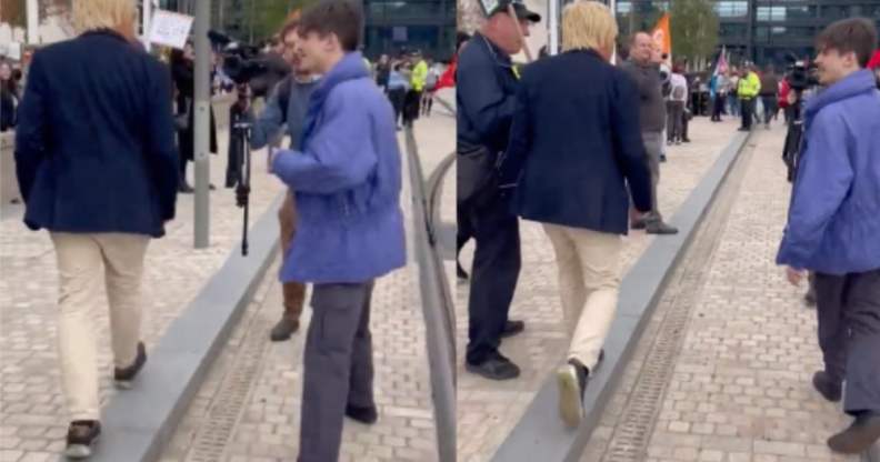 A protester approaching Michael Fabricant as he makes his way into the Conservative Party's conference in Birmingham.
