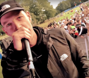 A screenshot of Welsh rapper Mr Traumatik performing at a festival